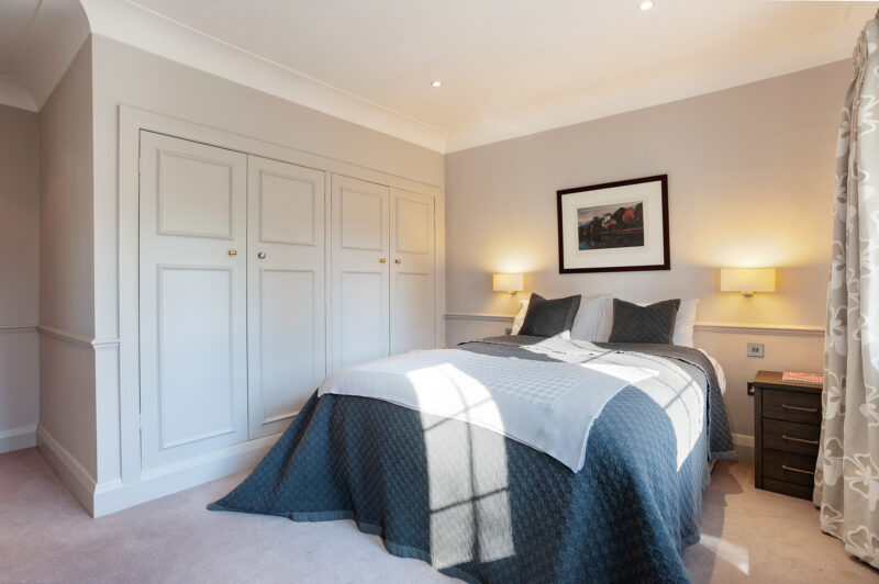 Bedroom double bed modern classic builtin wardrobe TV filming location hire lodge London 82