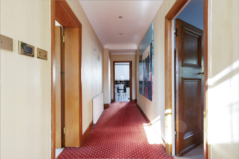 Long Hallway carpet doorways oak panelling 1930s corridoor TV filming location hire lodge London 42