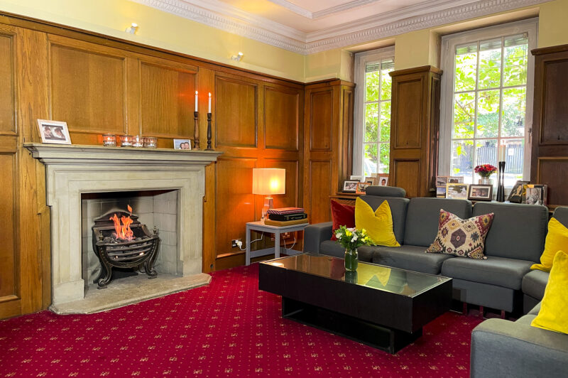 Lounge room sofa oak panel 1930s Art Deco fireplace filming location hire lodge London 100