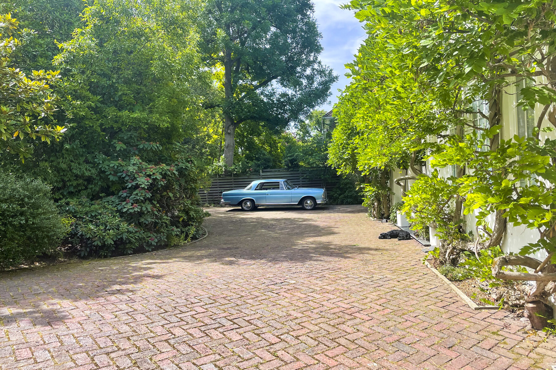 Classic car trees wisteria driveway brickwork filming location hire lodge London 10