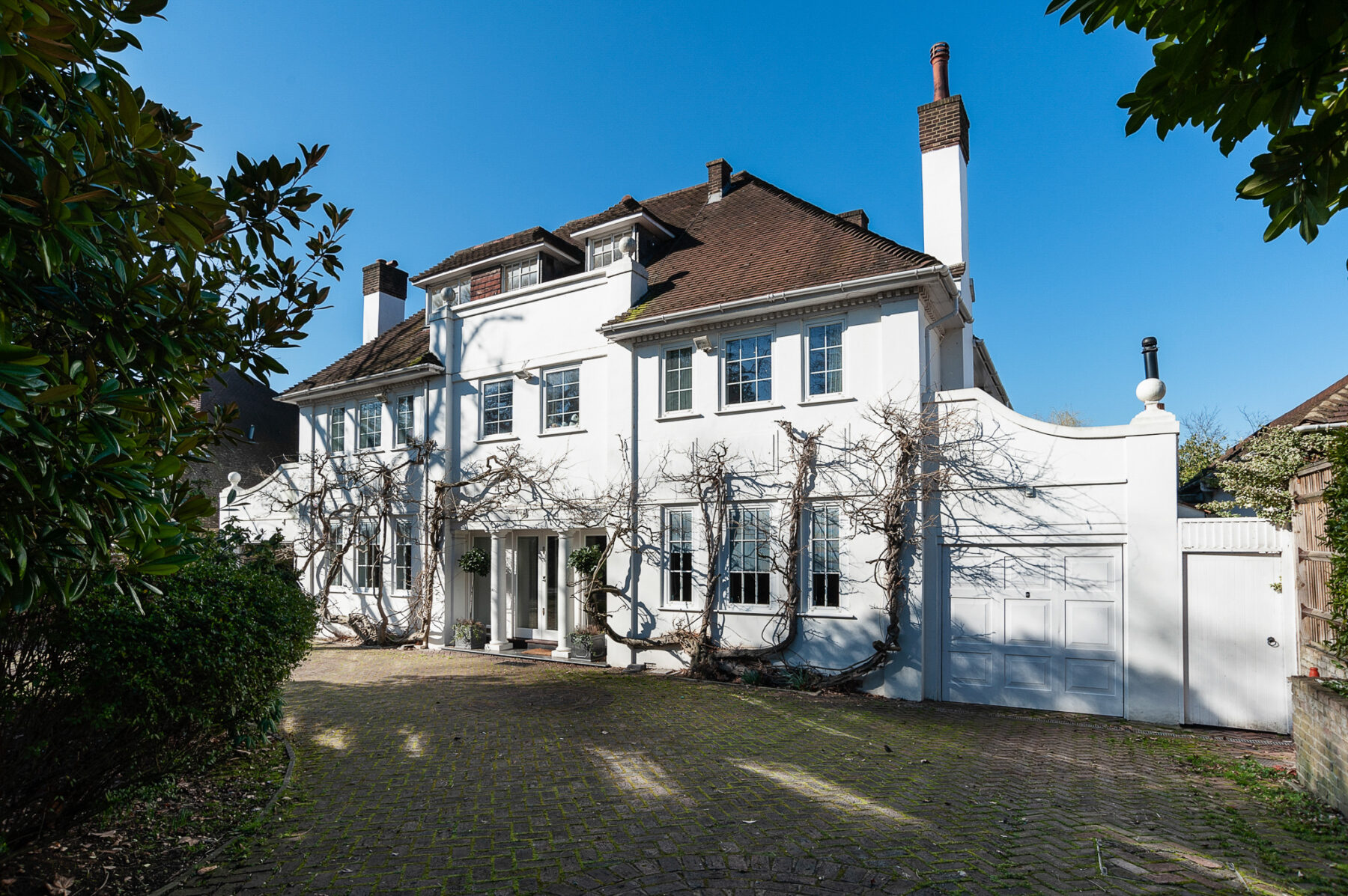Classic white house 1930s wisteria driveway spring filming location hire lodge London 11