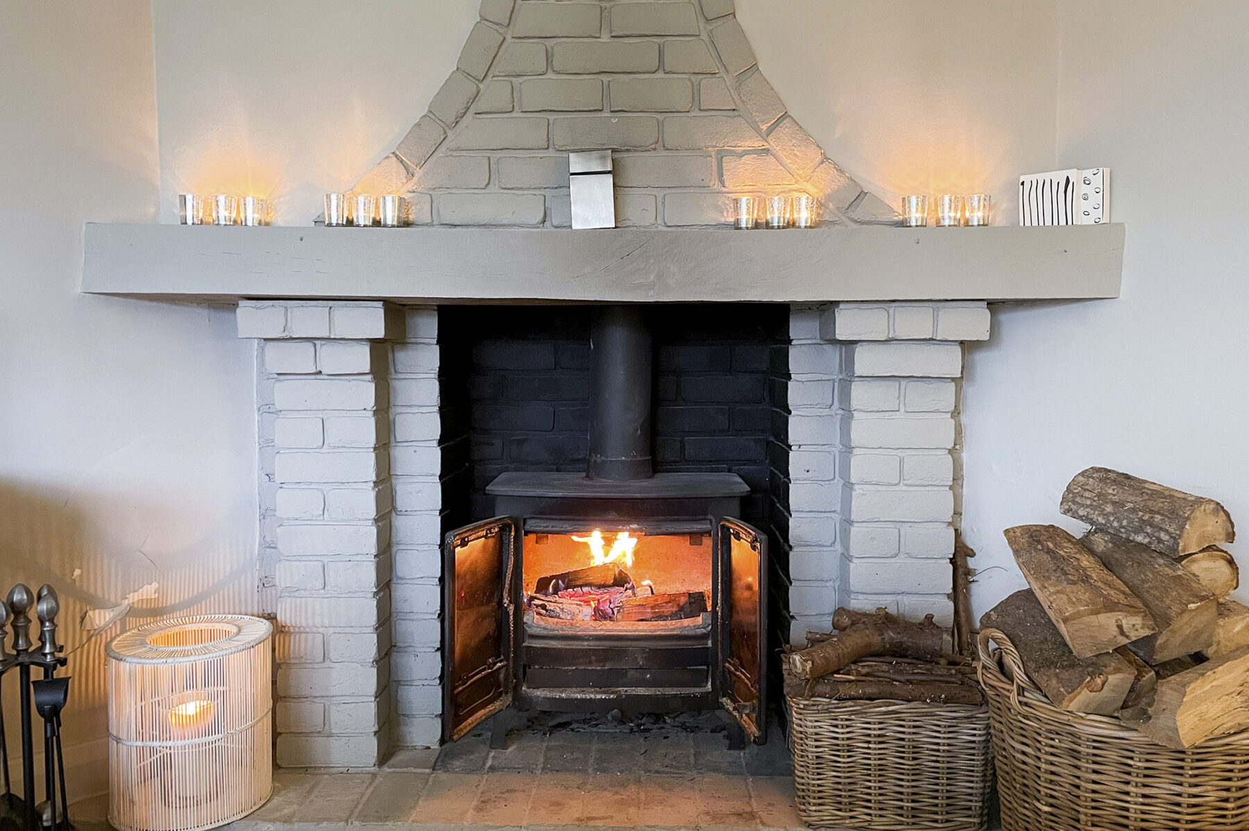 Dining room log fire basket bricks candles chimney hearth TV filming location hire lodge London 67