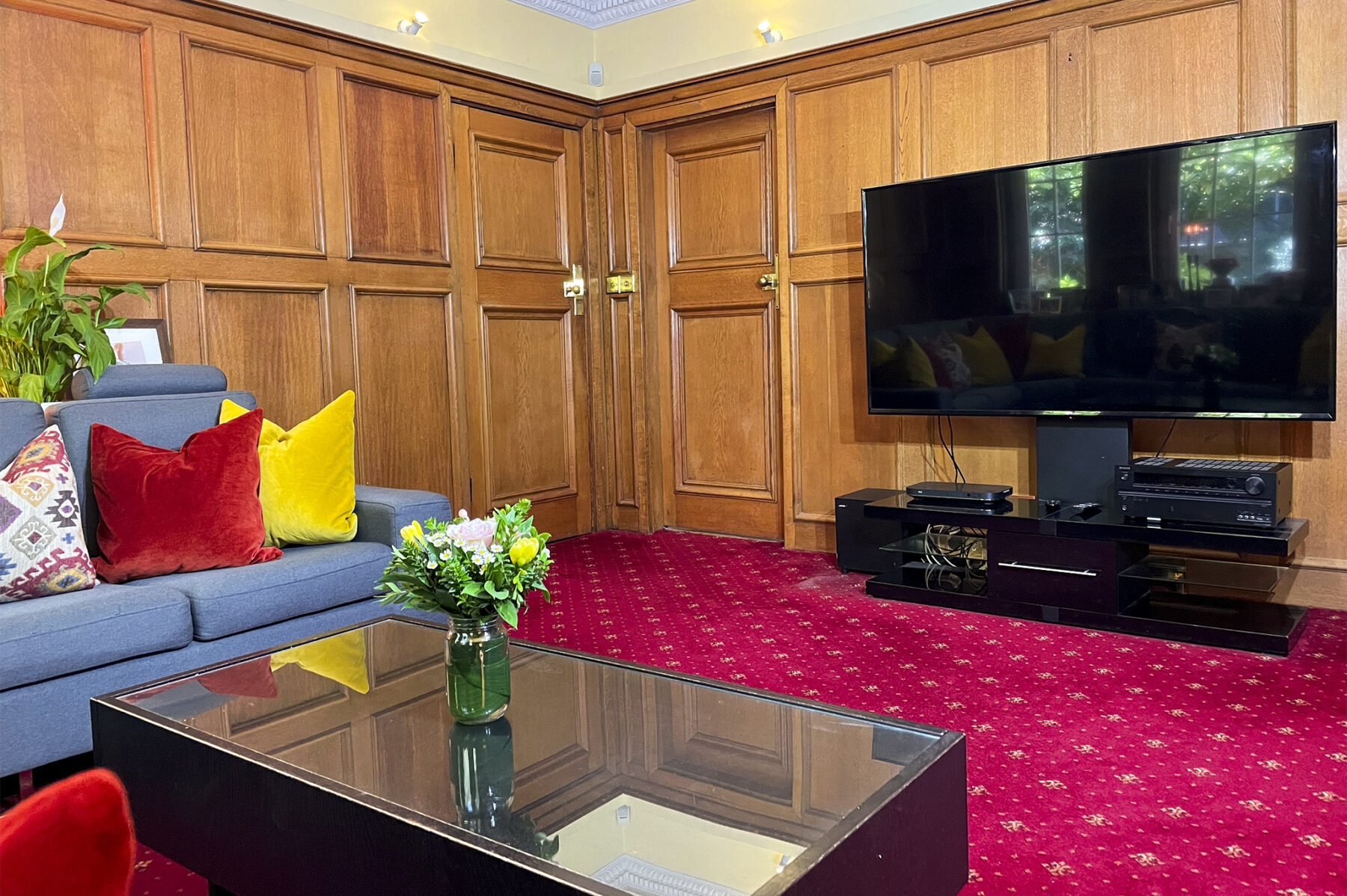 Lounge room sofa oak panel red carpet 1930s Art Deco TV filming location hire lodge London 99